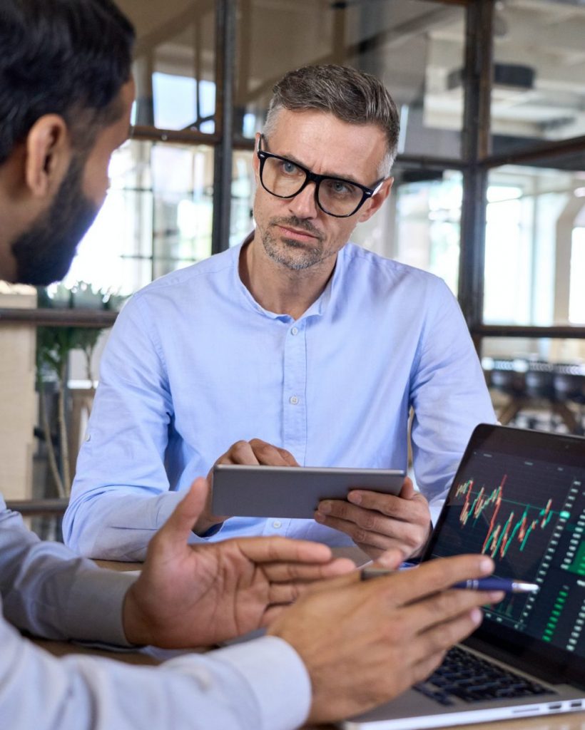 Two traders brokers stock exchange market investors discussing crypto trading. Two traders brokers stock exchange market investors discussing crypto trading.